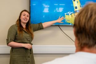 Leigh presenting her work from a screen