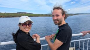 IDCORE Research Engineer - Tzu-Hsun Lin with colleague IDCORE Research Engineer - Tzu-Hsun Lin on a ferry with a colleague