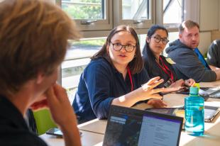 Researchers in discussion in the classroom