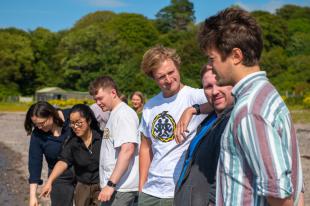 Group casually exploring the coastline