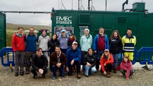 Group shot of ICDORE students in front of an EMEC hydrogen production facility